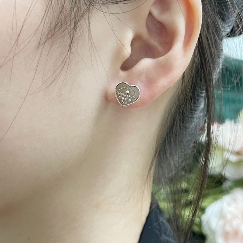T*f*ny earrings